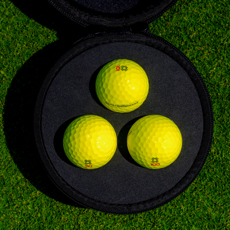 Three yellow CHIP’d smart golf balls inside a fitted protective case